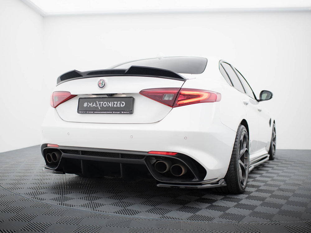 A white sports car is parked in a showroom with a tiled floor, featuring a sleek design and tinted windows. The license plate reads "#MAXTONIZED."