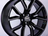 A glossy black alloy wheel featuring the 