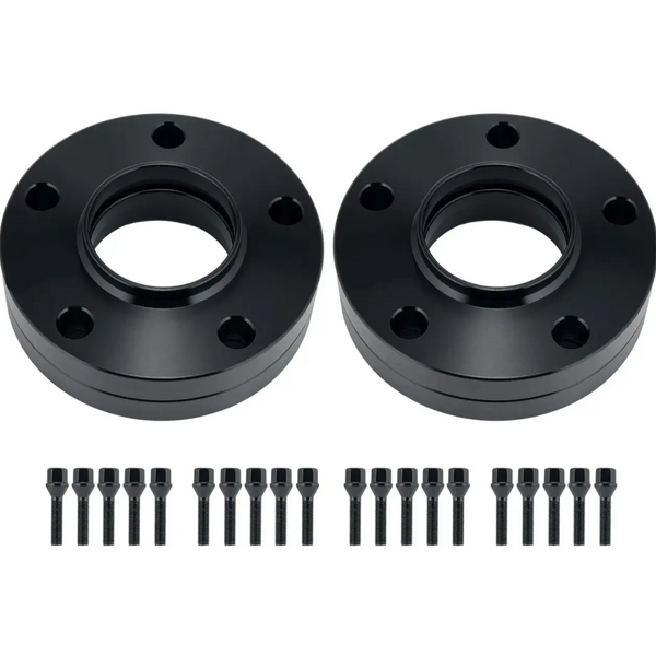 Two black circular wheel spacers with multiple bolt holes are placed side by side. Below each spacer, a row of black bolts and nuts is neatly aligned on a plain white background.