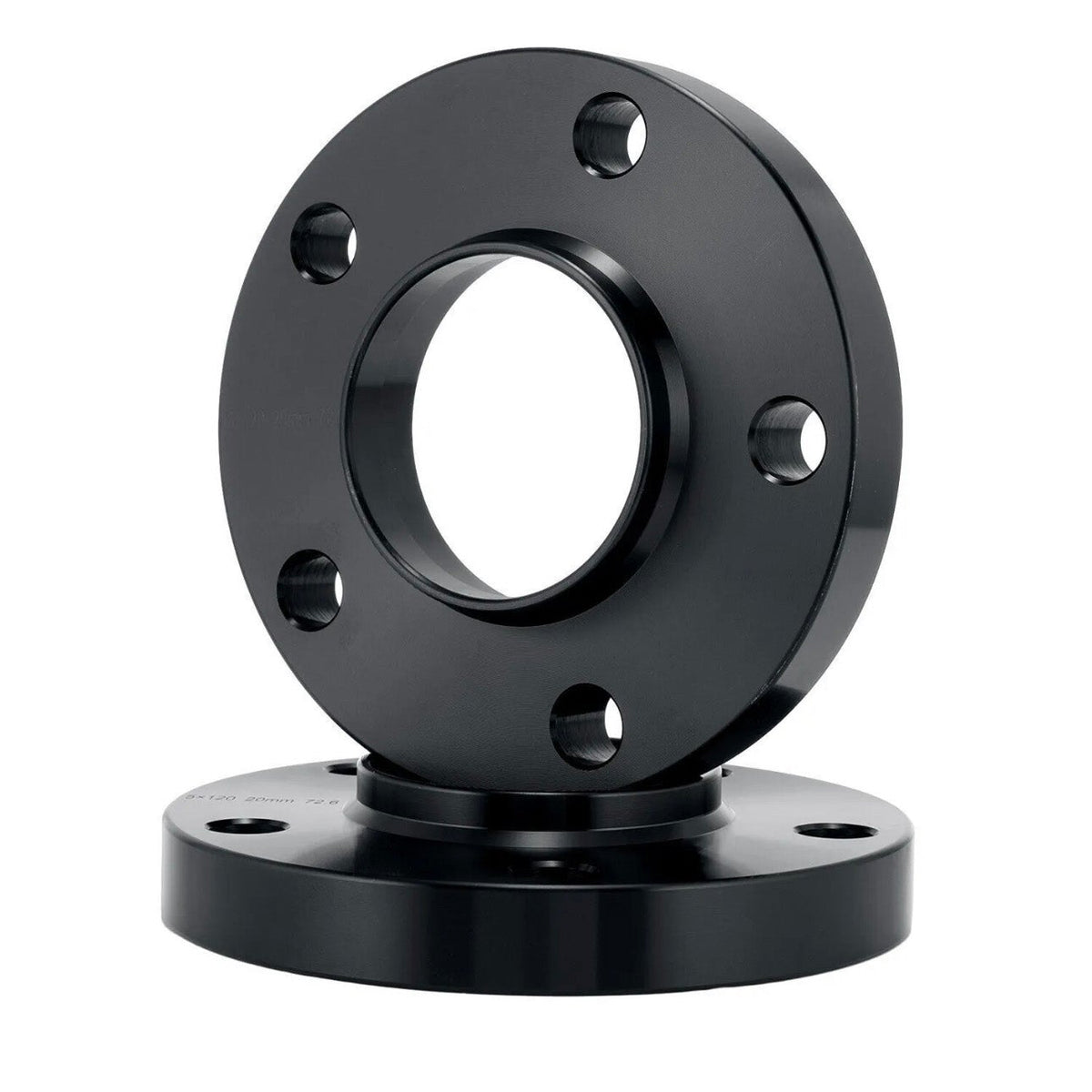 A black metal flange with bolt holes is stacked on another similar flange, positioned upright against a plain white background.