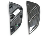 Two carbon fiber car parts are placed side by side; one shows a textured, reflective surface with three grooves, and the other reveals attachment clips. Text reads 