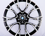A black and silver alloy wheel with a BMW emblem at the center, displaying a sleek design against a plain white background.