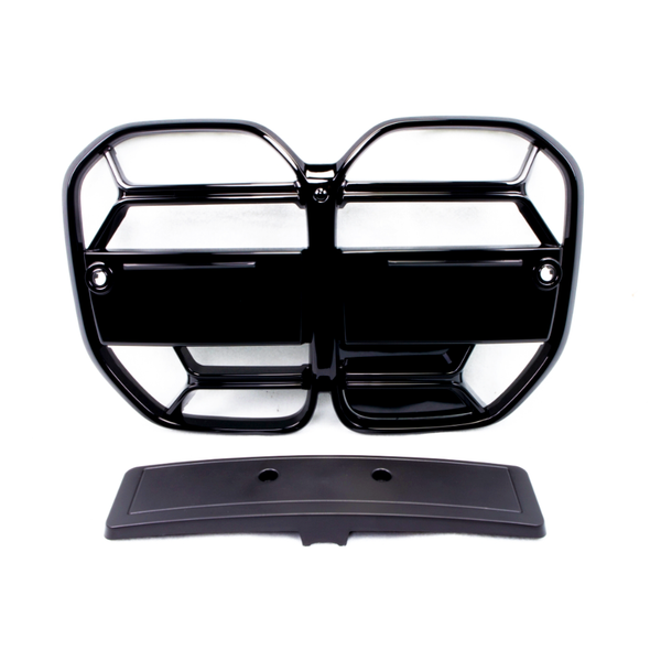 A black, glossy vehicle grille with a geometric pattern lays flat, accompanied by a separate rectangular piece below it, on a plain white background.