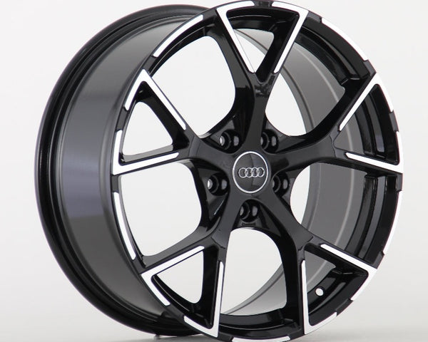 A glossy black alloy wheel with a five-spoke pattern, featuring the Audi logo at the center, displayed against a plain white background.