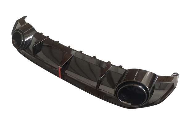 A glossy black car bumper diffuser with aerodynamic fins and round exhaust outlets on either side, positioned against a plain white background.