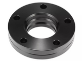 A black metal flange with five bolt holes is shown on a plain white background, with a central threaded opening surrounded by a smooth, polished surface.