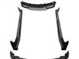 Black car body kit pieces are arranged on a white background, including a front lip spoiler, rear diffuser, and side skirts, suggesting an enhancement for vehicle aerodynamics and aesthetics.