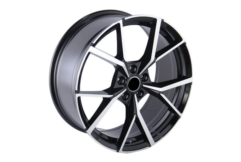 A black and silver alloy wheel with angular, geometric spokes, positioned at an angle against a plain white background.