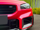 A red car front with a glossy finish displays the 