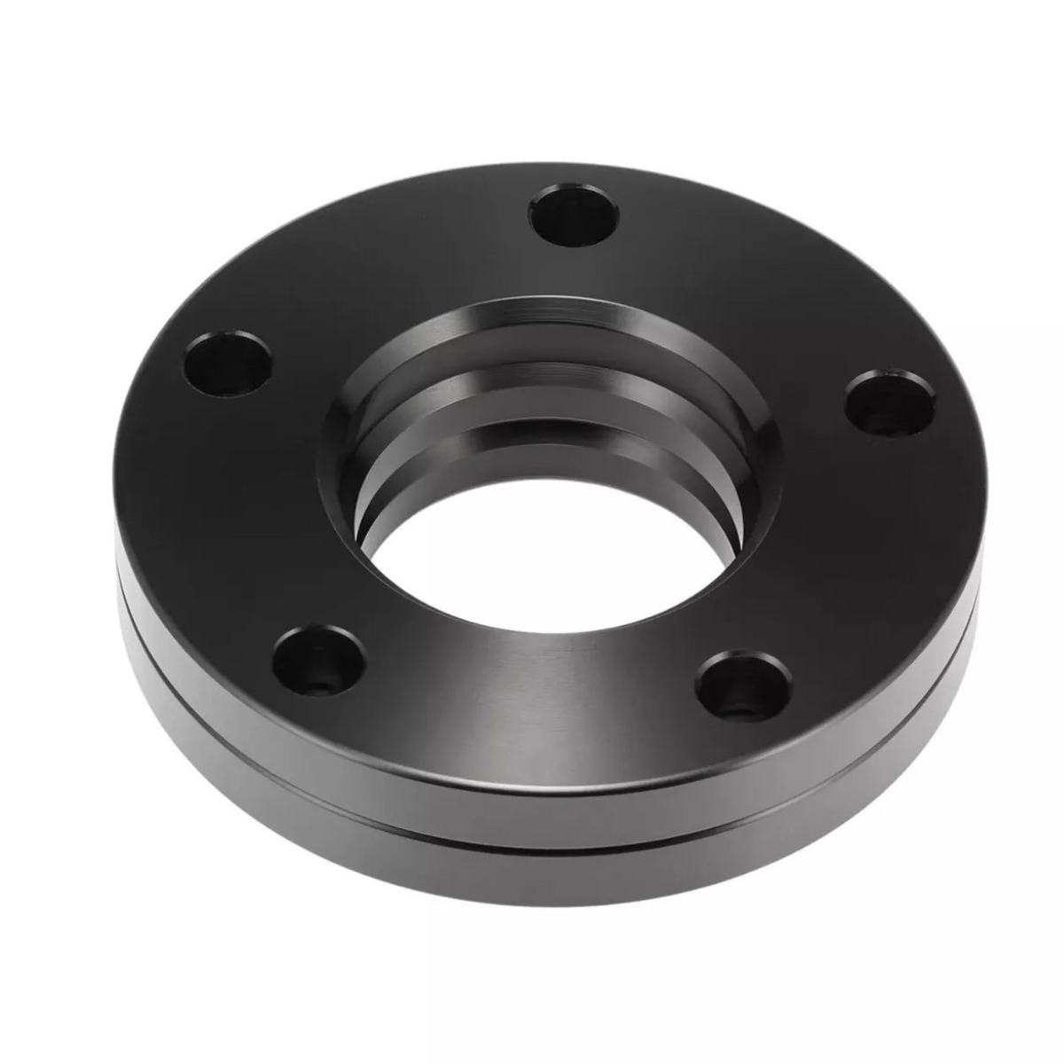 A black metal flange features five bolt holes and a central threaded opening, lying stationary against a plain white background.
