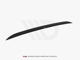 A sleek, black aerodynamic component with a smooth curve, is displayed against a white background. Text reads, 