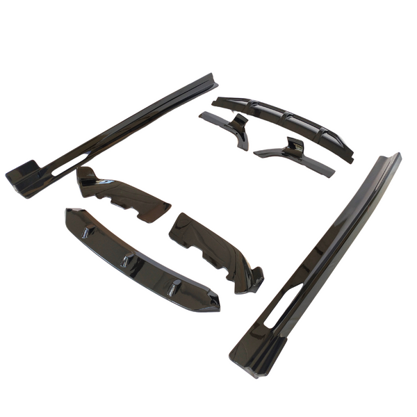 Black plastic car body kit components are arranged on a plain white background, showcasing various aerodynamic parts for vehicle customization.