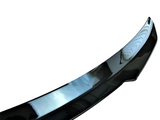 A sleek black car spoiler, curved and glossy, shown against a plain white background.