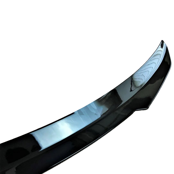 A sleek black car spoiler, curved and glossy, shown against a plain white background.