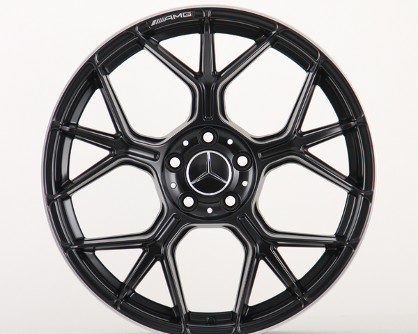A black alloy wheel with a multi-spoke design, featuring the Mercedes-Benz logo at the center and "AMG" text, against a plain white background.