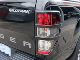 The truck's rear features a black tailgate with 