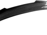 A black carbon fiber car spoiler with a glossy finish is displayed on a plain white background, showcasing its streamlined design and subtle curvature.
