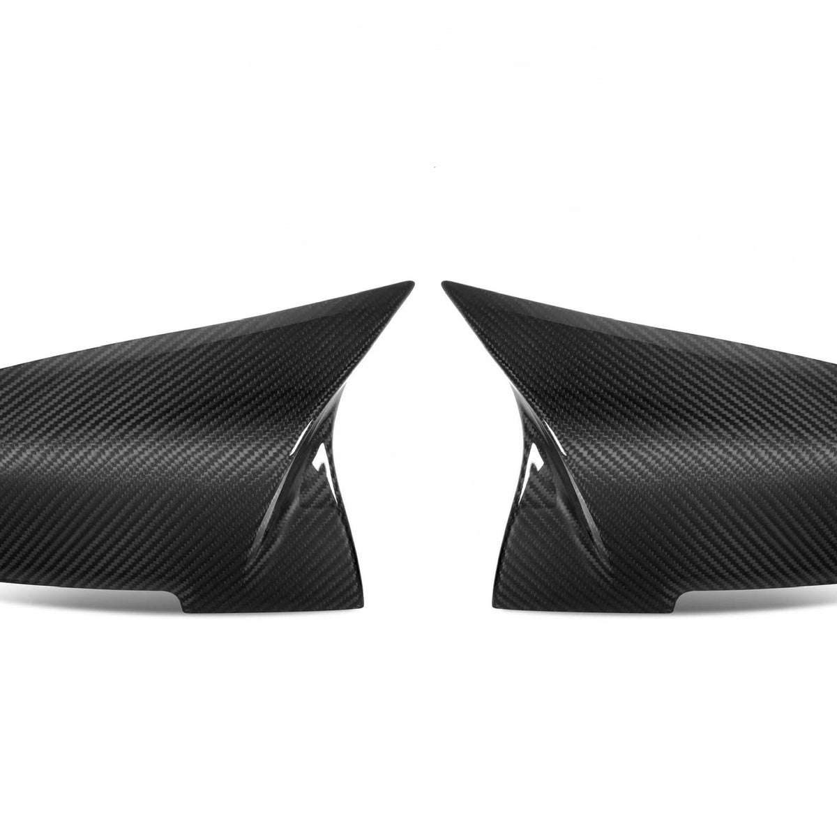 Two black carbon fiber car mirror covers, displayed symmetrically with pointed ends facing each other, set against a plain white background.