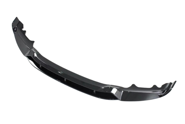 A sleek, black car spoiler sits isolated against a white background, showcasing its aerodynamic curves and glossy finish, designed to enhance vehicle performance.