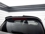 A car's rear window with a spoiler and brake light is parked in a garage. The walls are lined with horizontal white and black panels, creating a modern, enclosed space.