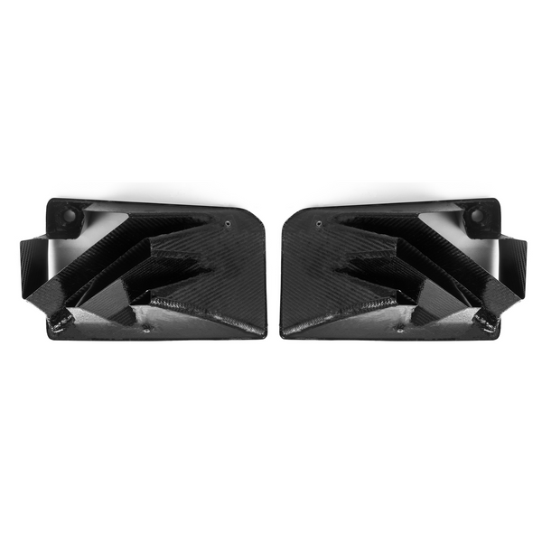 Two black carbon fiber air vents are positioned side by side, facing inward. They feature geometric, angular designs with a sleek, glossy finish, set against a plain white background.