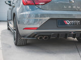The rear of a gray car, featuring dual exhaust pipes. 