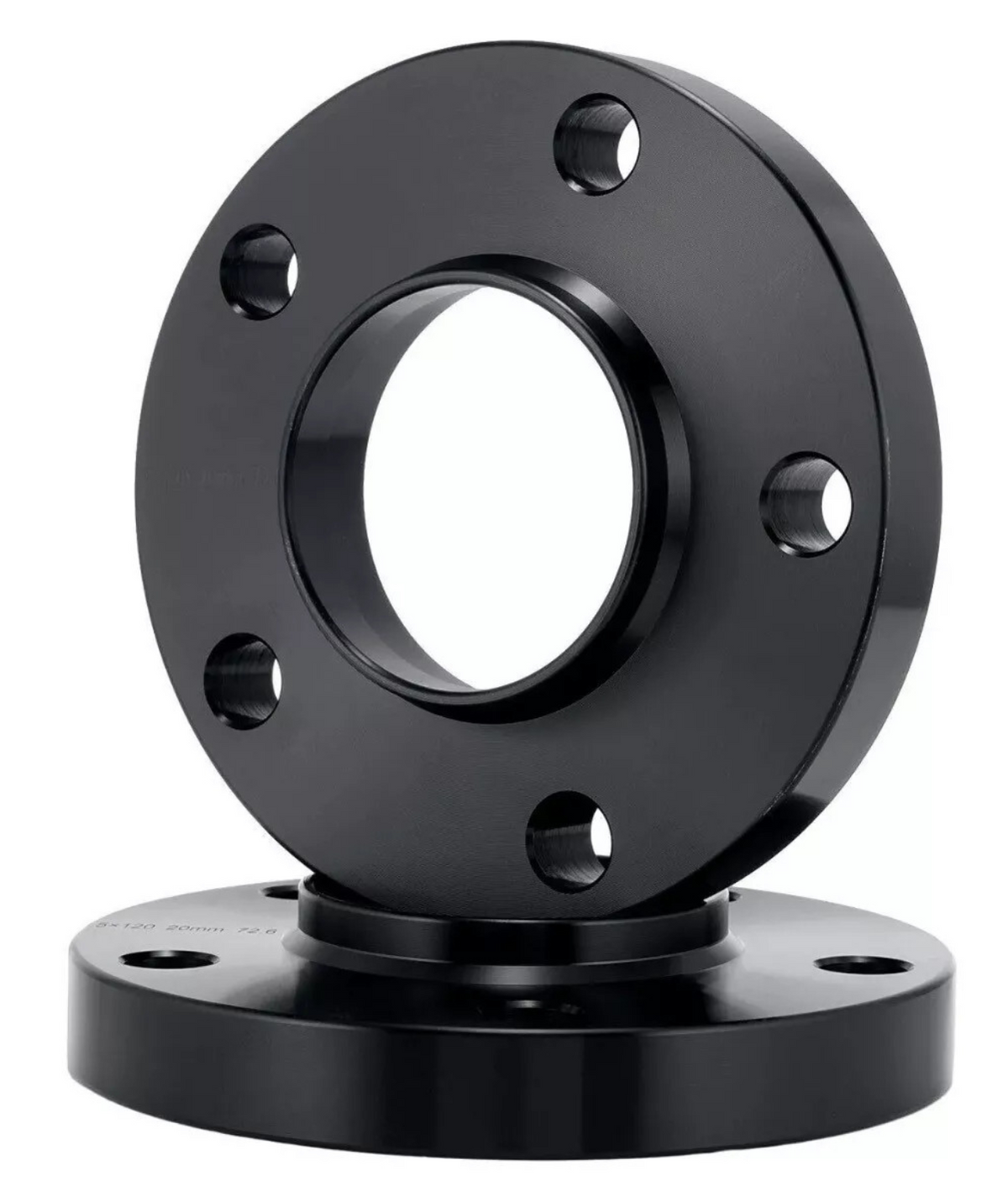 A black metal flange with multiple bolt holes is standing vertically on another similar flange in a studio setting, highlighting its circular shape and industrial design.