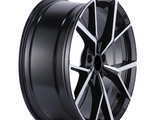A shiny black alloy wheel with a multi-spoke design and metallic accents, resting against a plain white background.