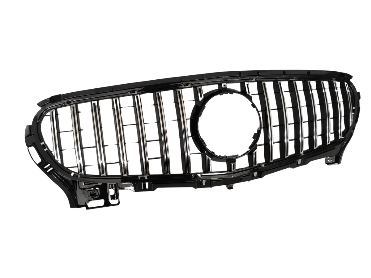 Car grille with vertical chrome slats and a central circular emblem cutout, set against a white background.