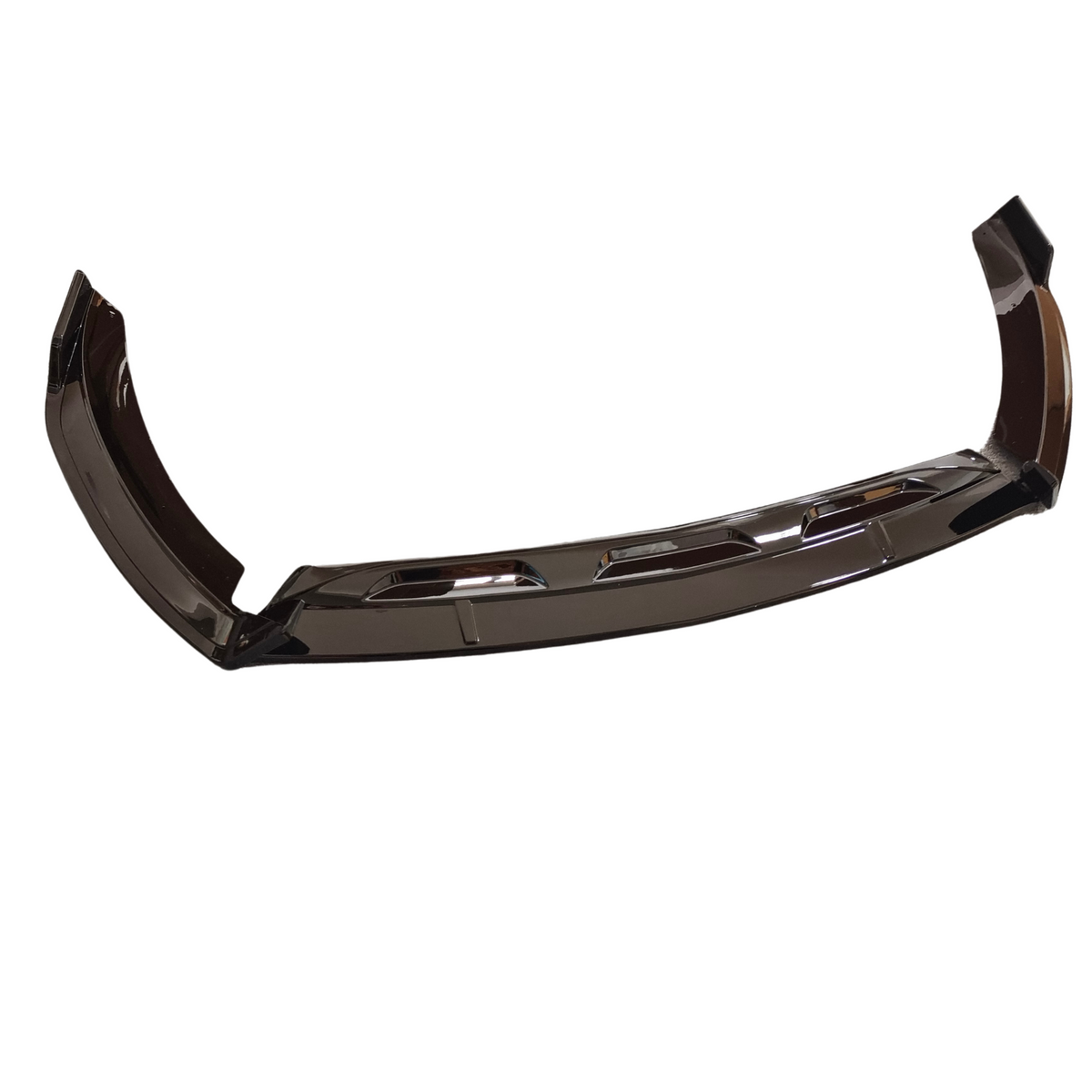 A glossy black car bumper, featuring aerodynamic contours and vent-like cutouts, rests on a plain white background.