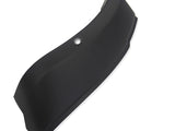 Curved black object with a smooth surface and a circular indentation, possibly a mounting hole, set against a plain white background.