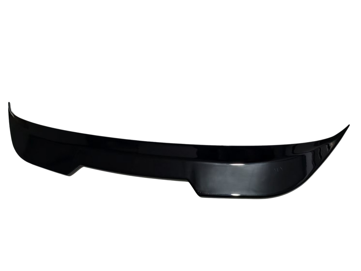 A glossy black car spoiler, gently curved with upward tips, rests in isolation on a plain, white background.