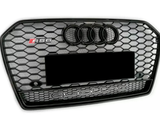 A hexagonal-patterned car grille displays the Audi logo and 