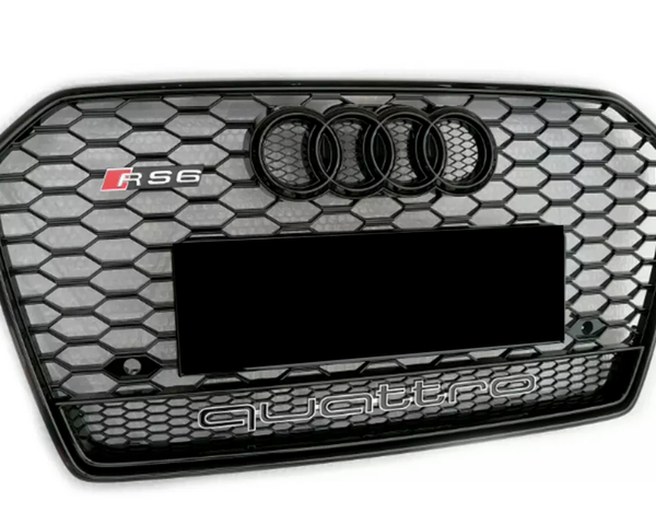 A hexagonal-patterned car grille displays the Audi logo and "RS6" on the top left. "quattro" is prominently indicated at the bottom against a black and silver honeycomb design.