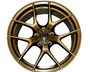 A metallic bronze alloy wheel with a multi-spoke design, displayed front-facing on a plain white background, showcasing its intricate style and smooth finish.