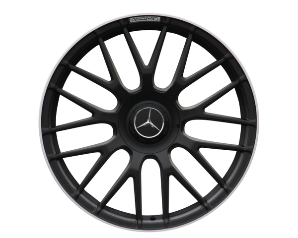 A black alloy wheel with a multi-spoke design features a central logo with a star symbol. The top edge displays the text "AMG." The background is plain white.