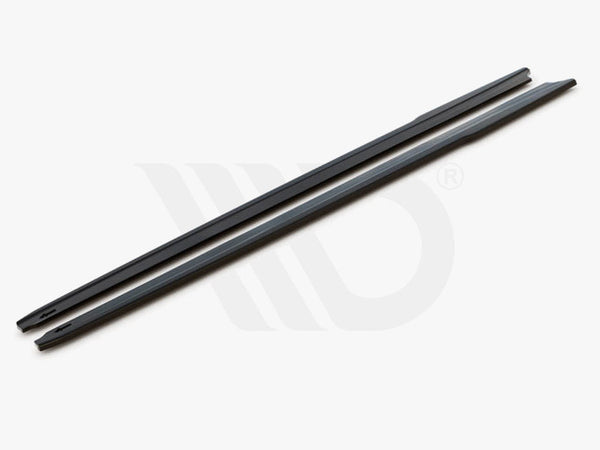 Two long, slim black bars rest parallel on a white surface. Text reads: "WORLDWIDE LEADER IN AERODYNAMIC COMPONENTS."