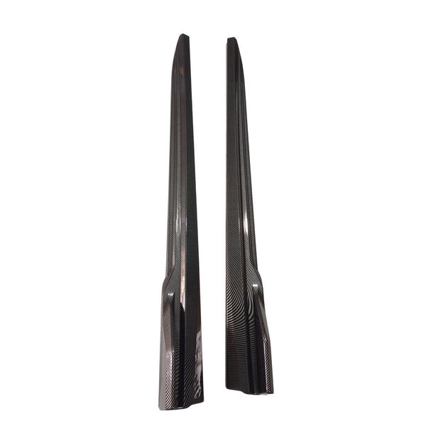 Two sleek, elongated, carbon-fiber panels are displayed vertically against a plain white background, emphasizing their glossy finish and distinct textured pattern.