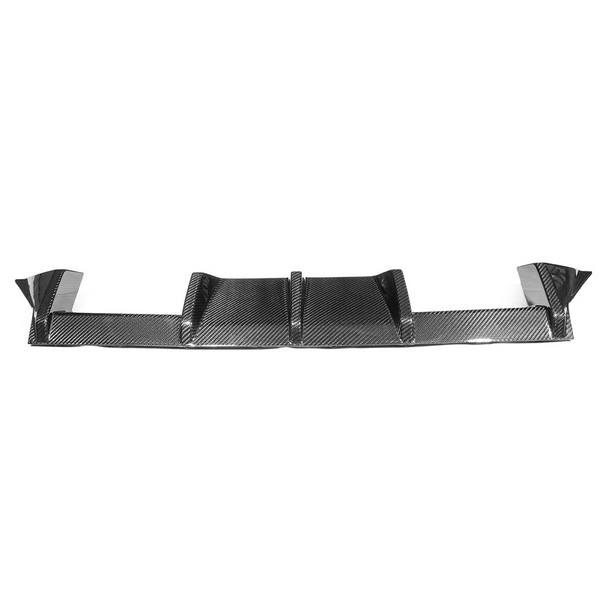 A carbon fiber car diffuser with multiple fins sits on a plain white background, emphasizing its textured finish and aerodynamic design.
