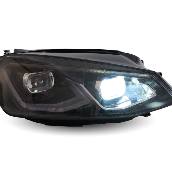 A car headlight brightly illuminates against a white background, showcasing its sleek design and clear lens, highlighting modern automotive lighting technology.