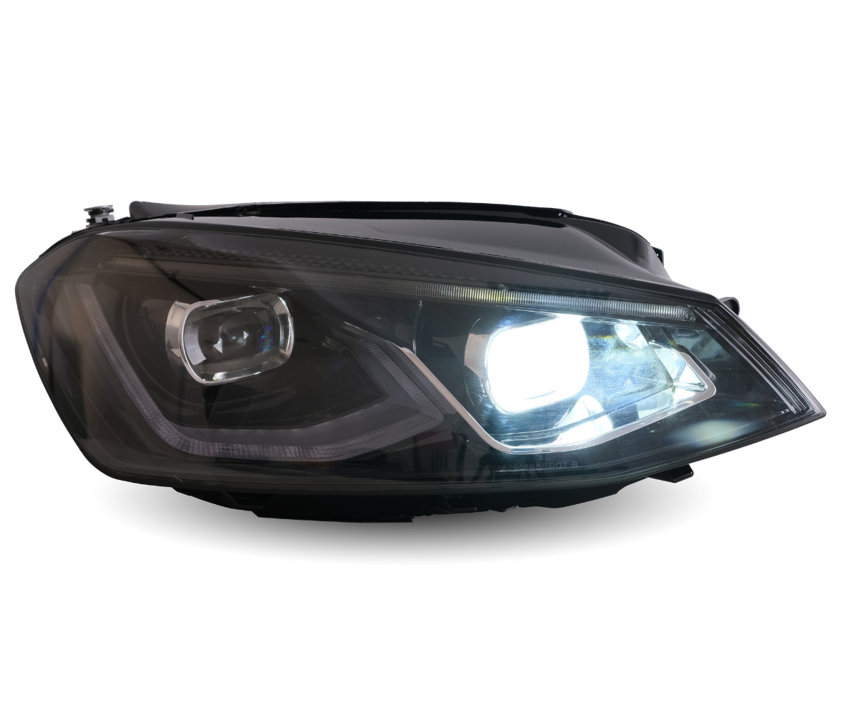 A car headlight brightly illuminates against a white background, showcasing its sleek design and clear lens, highlighting modern automotive lighting technology.