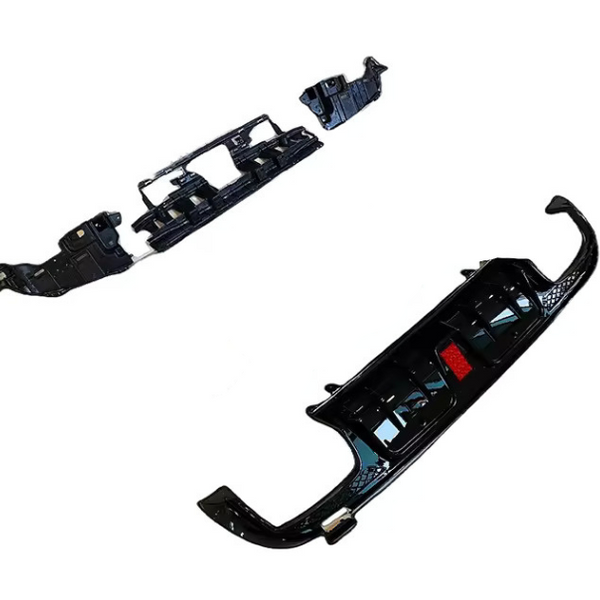 Black car bumpers are laid out separately on a plain white background, showcasing their curved and angular design features.
