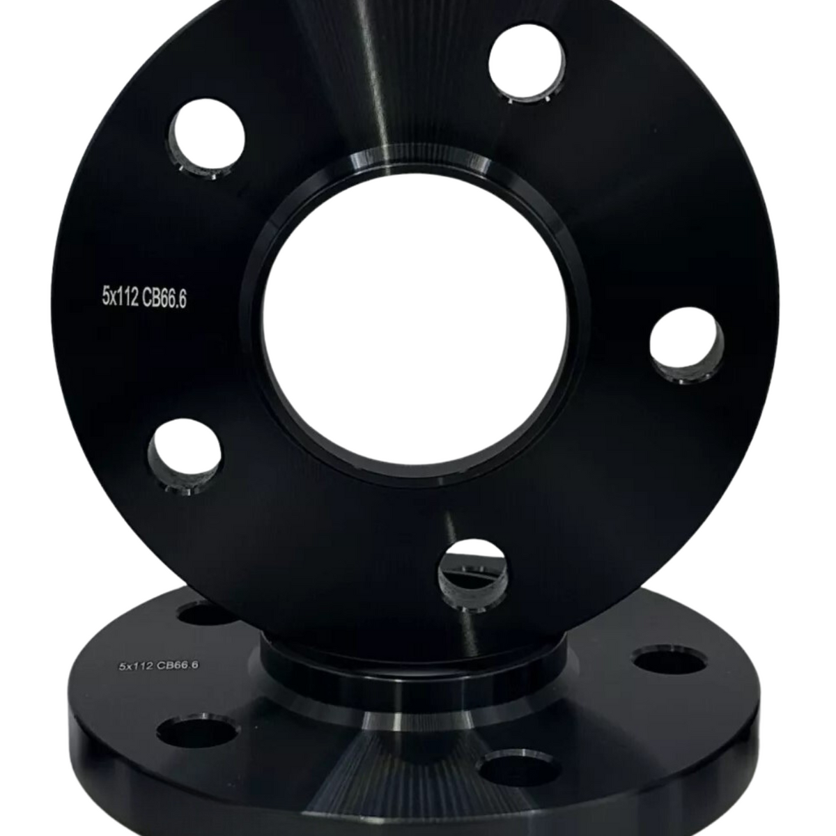 A pair of black wheel spacers feature five bolt holes. One is upright, while the other lies flat beneath. Text on both spacers reads "5x112 CB66.6".
