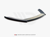 Curved aerodynamic car spoiler lies on a plain surface. Text below reads, “WORLDWIDE LEADER IN AERODYNAMIC COMPONENTS.” It features sleek design elements positioned in a minimalist environment.