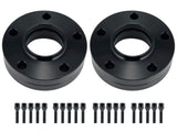 Two black wheel spacers with holes are aligned horizontally; each is accompanied by a row of ten matching black bolts beneath them. Set against a plain white background.