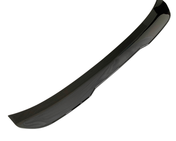 A sleek, glossy black car spoiler curves slightly upward, designed for aerodynamic efficiency, displayed against a plain white background.