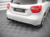 A white Mercedes-Benz A250 is parked on a patterned gray floor, displaying its rear view. The license plate reads 