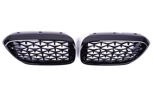 Two black car grilles with a diamond mesh pattern are positioned side by side on a plain white background.