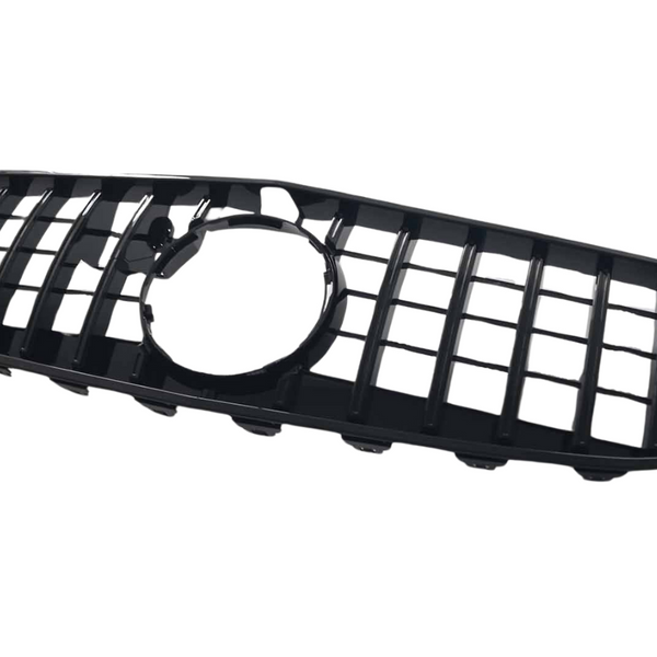 A black, rectangular car grille with a grid pattern and a circular opening in the center, set against a plain white background.