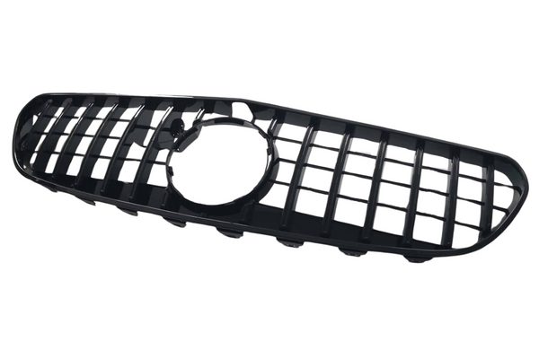 A black, rectangular car grille with a grid pattern and a circular opening in the center, set against a plain white background.